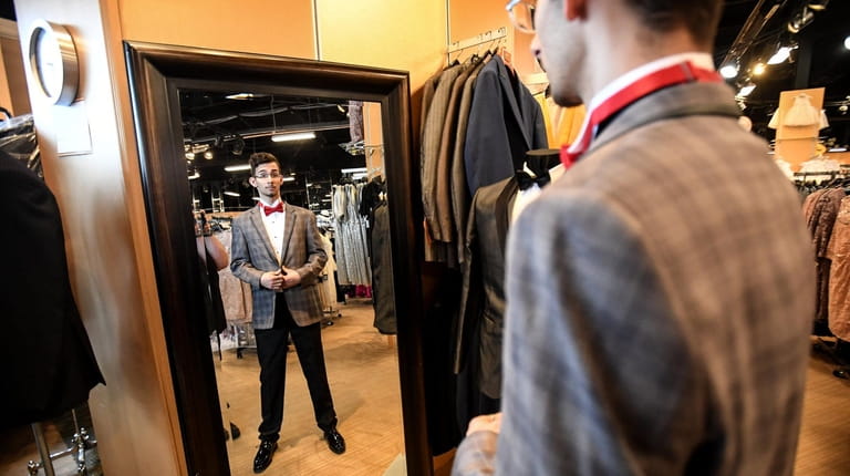 Keanu Waters tries on looks at Black Tie Tuxedo by...