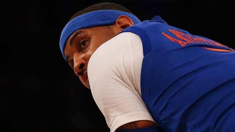 Carmelo Anthony #7 of the New York Knicks looks on...