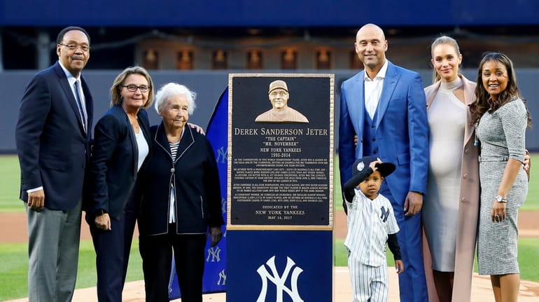 Derek Jeter and his family pose for a photograph with...