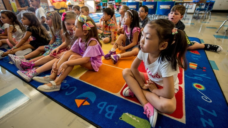 Kindergarten students gather in their classroom at Robert Seaman Elementary...