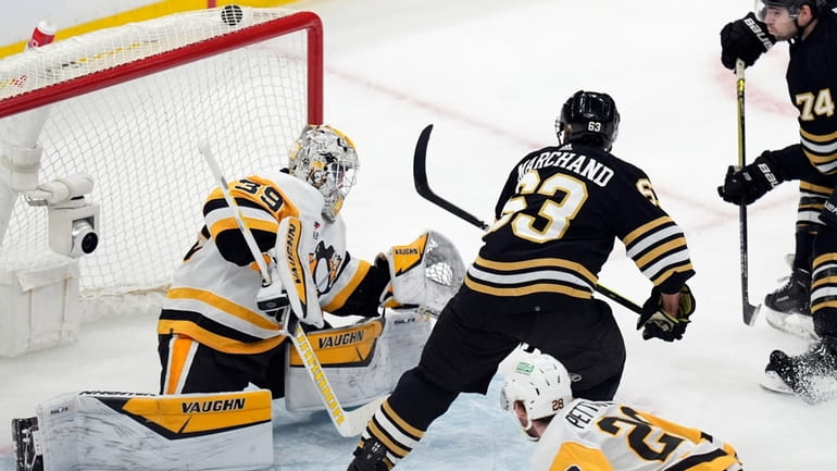 Boston Bruins' Brad Marchand (63) scores on Pittsburgh Penguins' Alex...