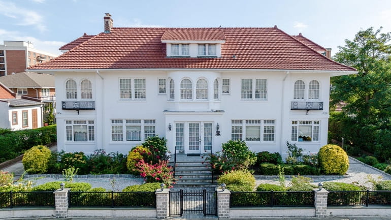 The 11-bedroom, 4½-bedroom stucco house built in 1915 has 6,164 square feet...