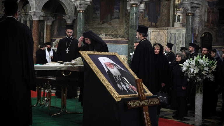 A Bulgarian Orthodox nun pays her last respects to Bulgarian...