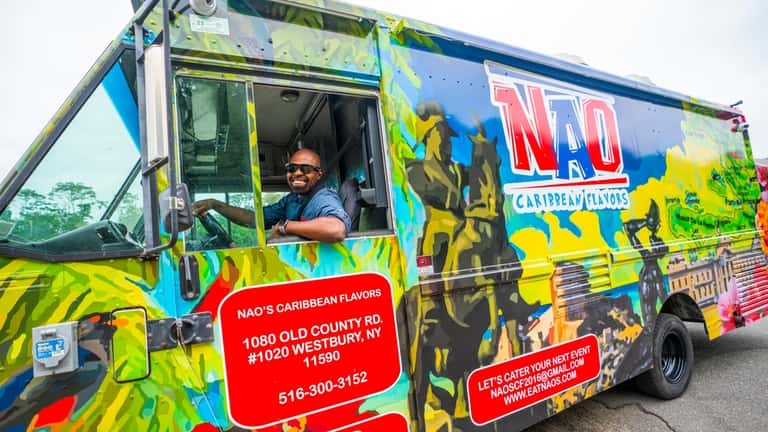 Tony Jean, co-owner of Nao's Caribbean Flavors food truck pulls...