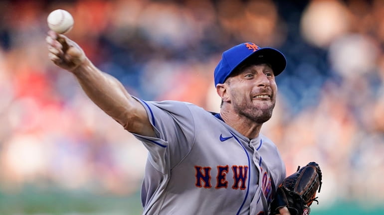New York Mets starting pitcher Max Scherzer throws during the...