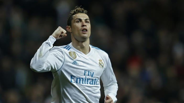 Real Madrid's Cristiano Ronaldo celebrates after scoring his side's fifth...