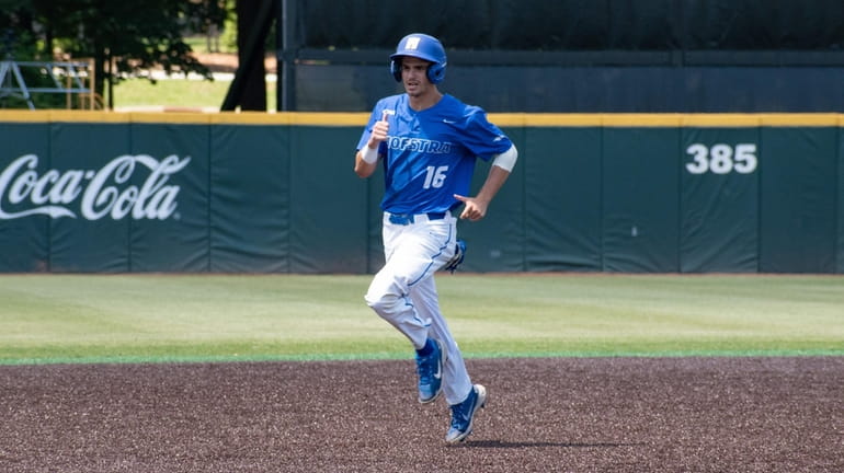 Hofstra's Will Kennedy rounds the bases after his home run...