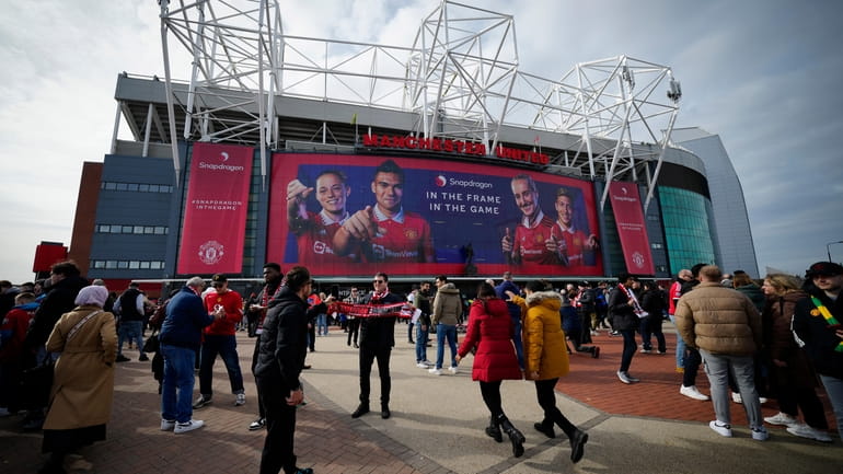 Fans outside the Old Trafford stadium in Manchester ahead the...