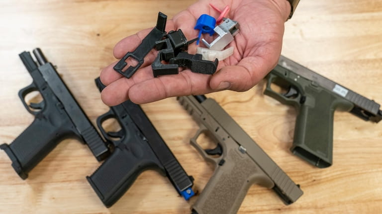 A handful of fully automatic conversion devices is displayed for...