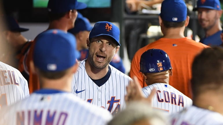New York Mets starting pitcher Max Scherzer is greeted in...
