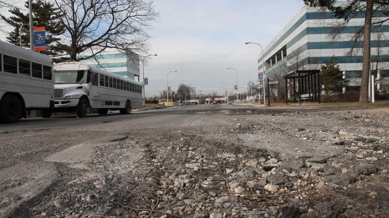 A pothole remains open on Selfridge Avenue on Wednesday, March...