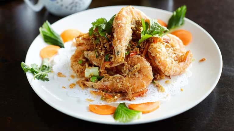 Salt and pepper shrimp are fried, heads, tails, shells and...