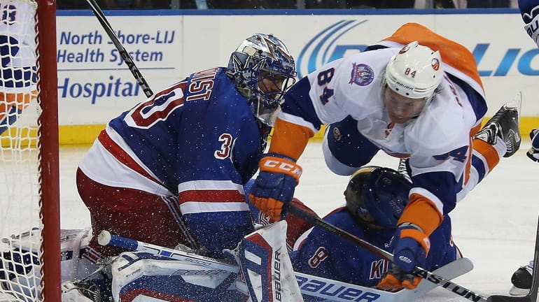 Mikhail Grabovski #84 of the New York Islanders flies past...