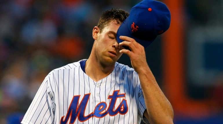 Steven Matz of the Mets walks to the dugout against...