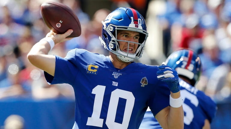 Eli Manning of the Giants throws a pass during the...
