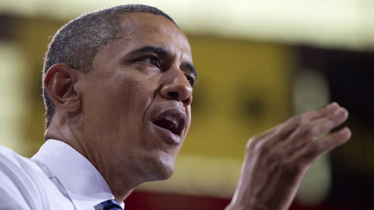 President Barack Obama speaks at the University of Iowa, in...