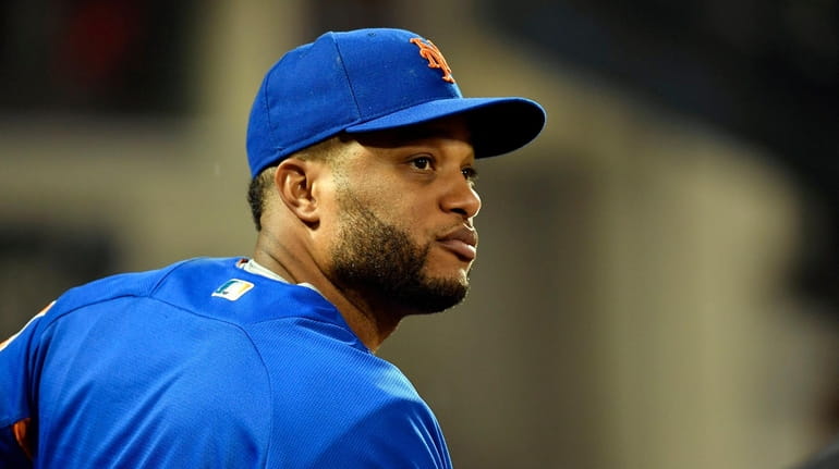 Robinson Cano watches the action during the Mets-Cubs game at...
