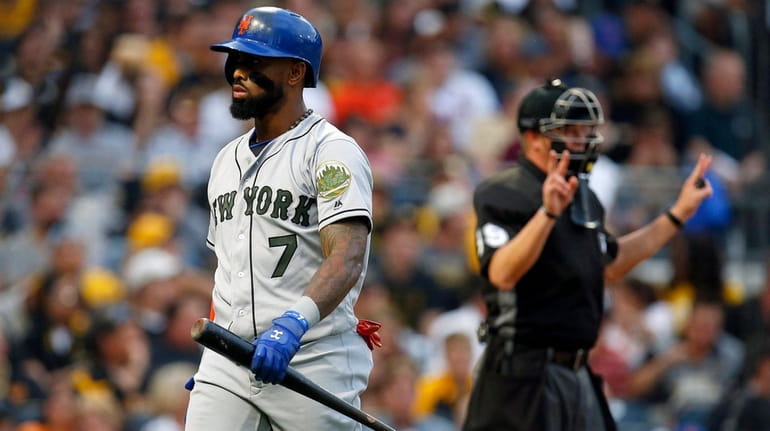 Jose Reyes of the New York Mets looks on after...