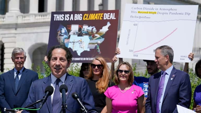 Rep. Jamie Raskin (D-Md.), second from left, speaks about the climate...
