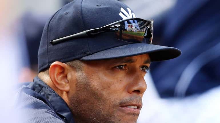 Mariano Rivera looks on from the dugout during a game...
