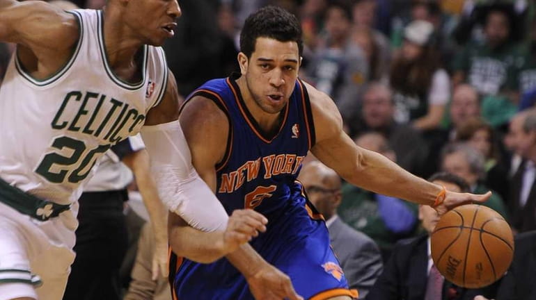 Landry Fields driving to the basket against the Boston Celtics'...