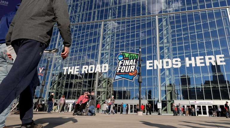 Fans arrive at U.S. Bank Stadium before the championship between...