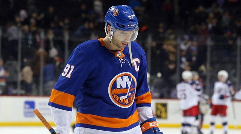 Islanders center John Tavares leaves the ice after losing to...