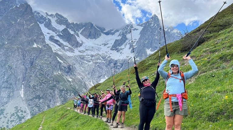 Women hike the Tour du Mont Blanc in France on...