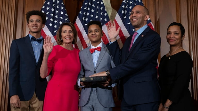 Speaker of the House Nancy Pelosi performs the ceremonial swearing-in...