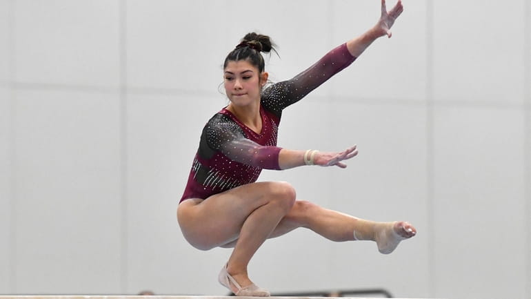 Kayla DiCello performs on the balance beam at the USA...