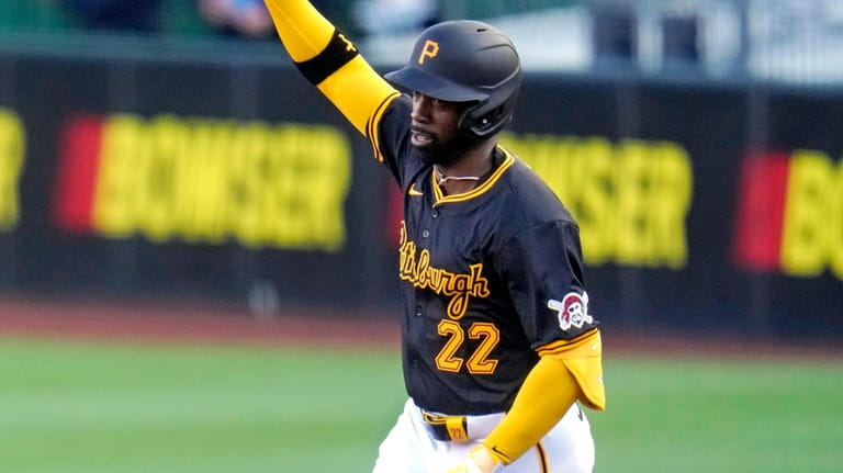 Pittsburgh Pirates' Andrew McCutchen celebrates as he rounds the bases...