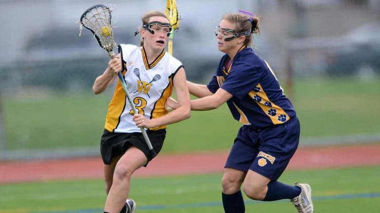 Wantagh's Colleen Lovett (3) drives to the cage during the...