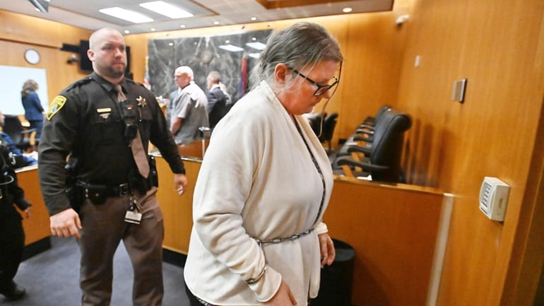 Jennifer Crumbley leaves the courtroom after a jury found her...