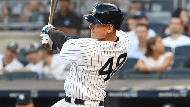 Yankees designated hitter Anthony Rizzo hits a three-run home run...