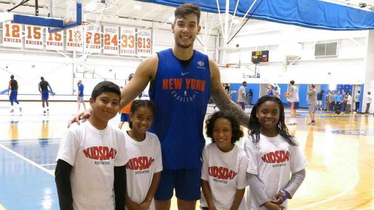 Knicks player Willy Hernangómez with Kidsday reporters, from left, Daniel...