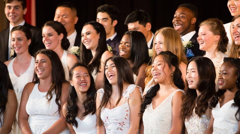 Graduates sing during The Waldorf School commencement Friday.