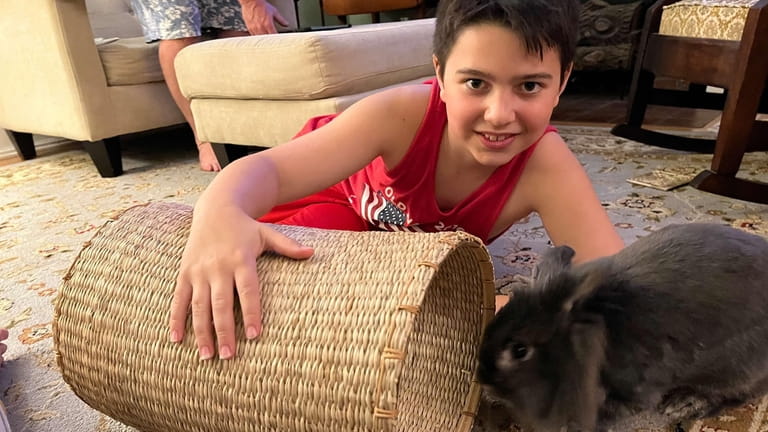 Jackson Shaw with Ru, a bunny that was rescued by...