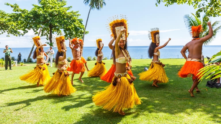 Polynesian women perform traditional dance in Papeete, on Tahiti. Polynesian dances...