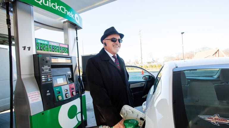 Lawrence Curcio of Bellport fills his tank at the QuickChek...