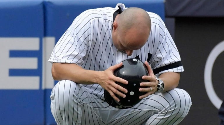 Yankees third base coach Joe Espada reacts after a young...