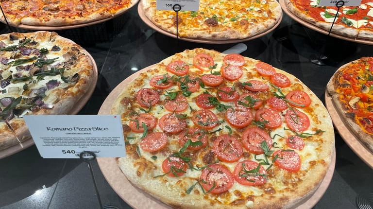 Customers can buy fresh pizzas to reheat at home, or...