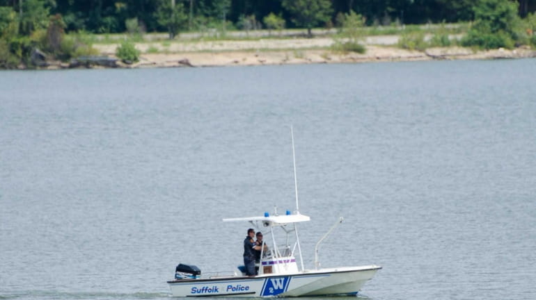 Suffolk police resumed their search Saturday, Aug. 16, 2014, for...