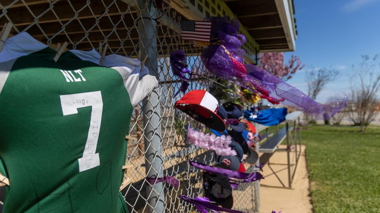 A makeshift memorial Monday at a Little League field in...