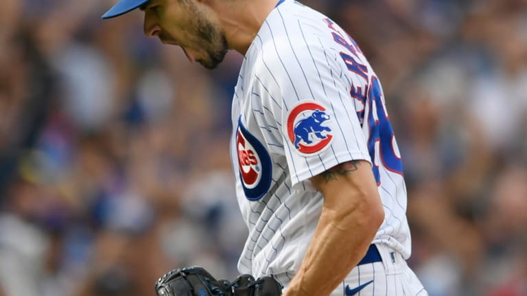 Chicago Cubs closing pitcher Julian Merryweather celebrates after defeating the...
