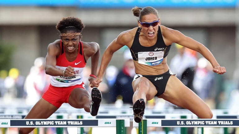 Christina Manning and Lolo Jones compete in the women's 100...