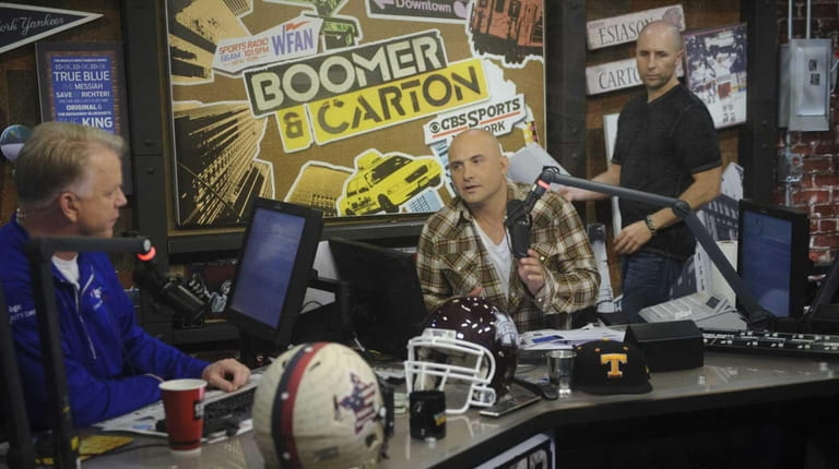 From left, co-hosts Boomer Esiason and Craig Carton and producer Al...