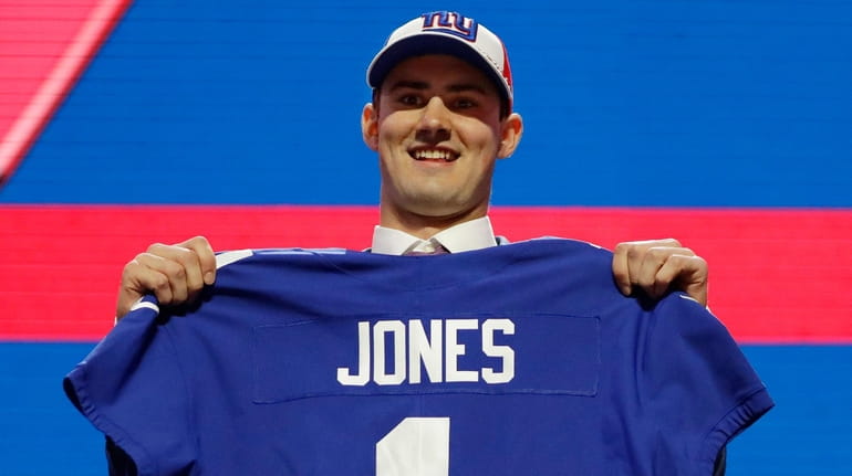 Duke quarterback Daniel Jones poses with his new jersey after...