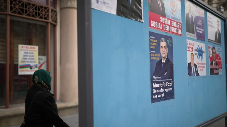 Election posters of all Azerbaijani presidential candidates are displayed in...