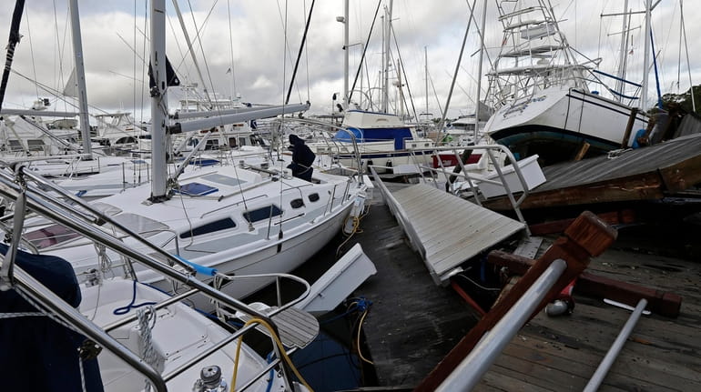  Boats are piled on each other in the marina after Hurricane...