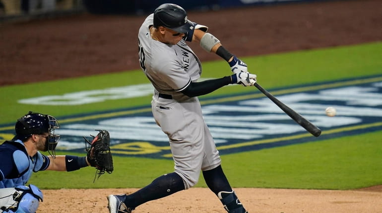 New York Yankees' Aaron Judge  connects for a solo home...